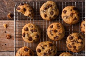 Chocolate chip cookies cooling on a wire rack