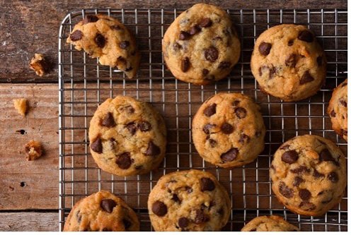Chocolate chip cookies cooling on a wire rack