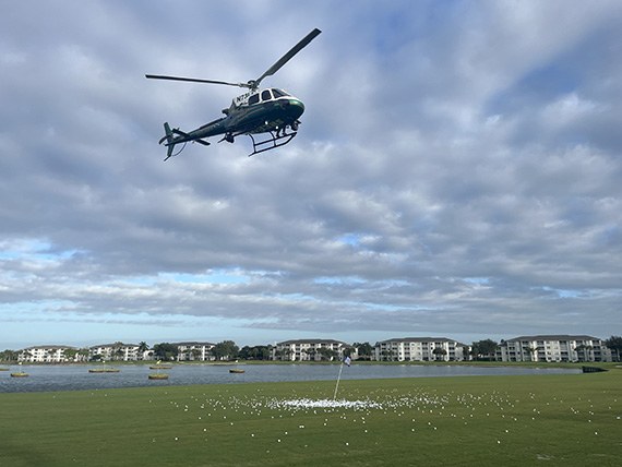 Sheriff's Department helicopter flying over the driving range for the ball drop