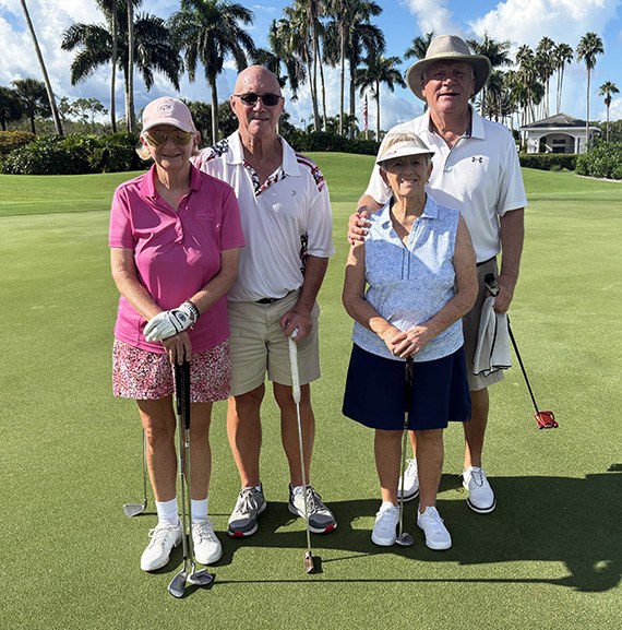 Lucinda and Bill Jordan with Cathy and Doug Dean under the palms
