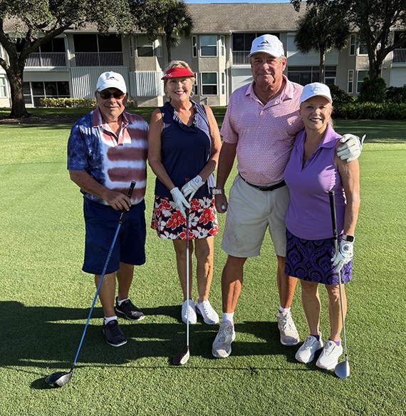 John and Mary Grill with Tim and Lisa Cornett on the course