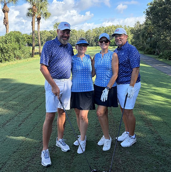Tony and Lisa Gordon with Shawna and Bob Fay on the cart path