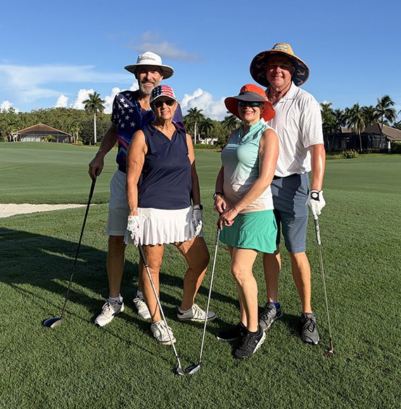 Doug and Elena Muller with Karen Newman and Lee Vann on the course