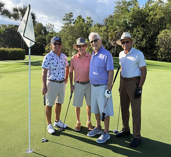 Matt Olinyk, Bob Redar, John Shaughnessy and PC Shetty on the putting green