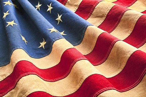 Folds of an early American flag with stars and stripes