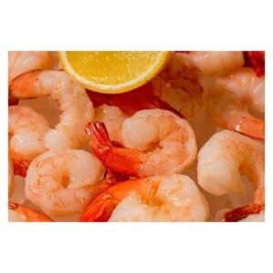 Bowl of cooked shrimp with a lemon slice