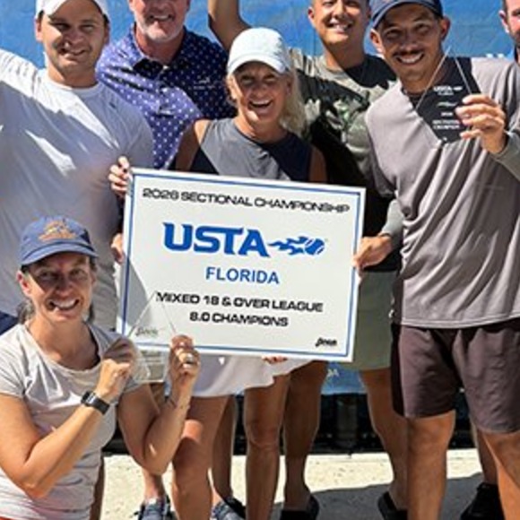 Team holding the 2026 USTA Florida Sectional Championship sign for the Mixed 18 and Over League 8.0 division