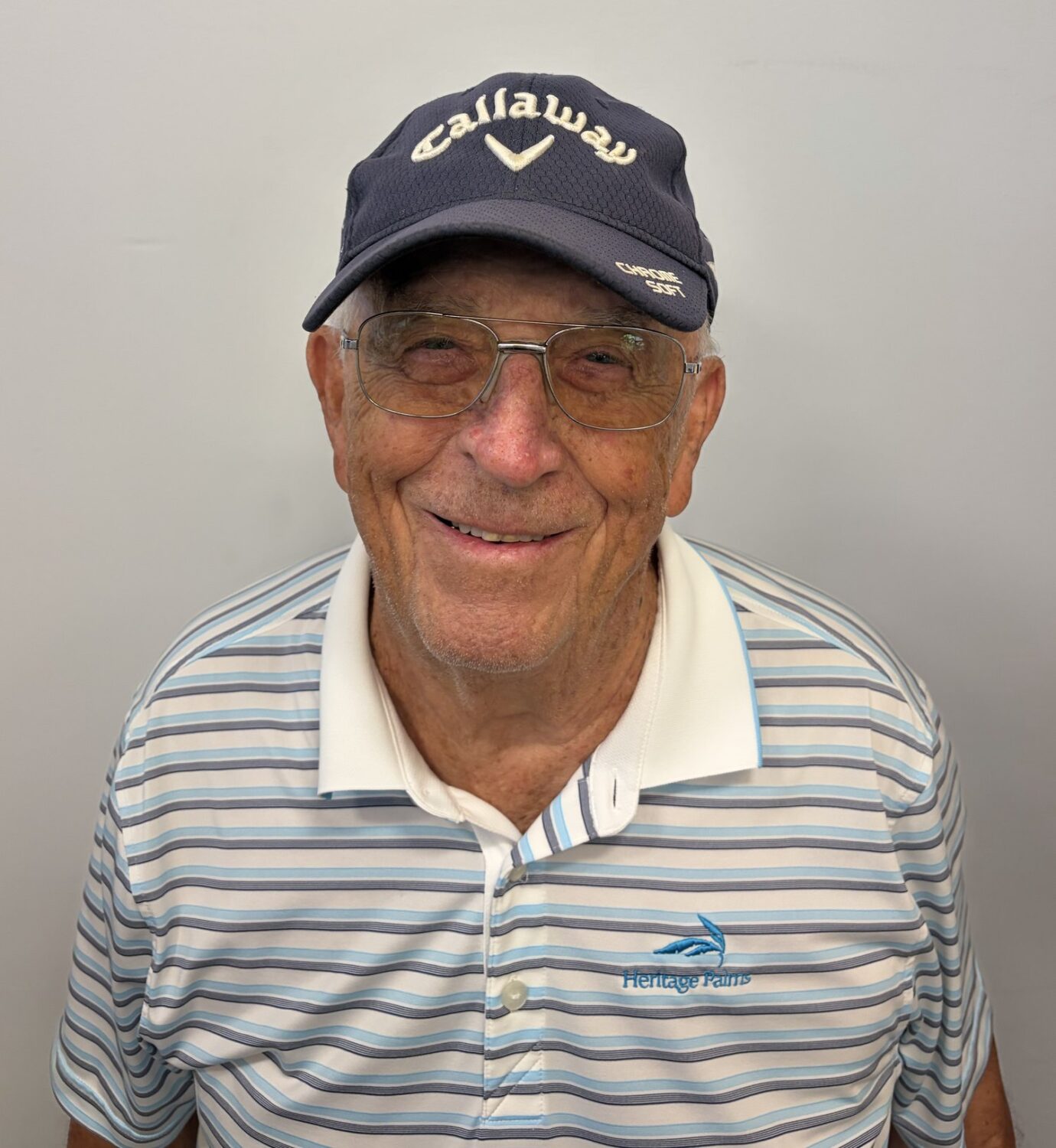 Chuck Schmitz in a Callaway cap and Heritage Palms golf shirt